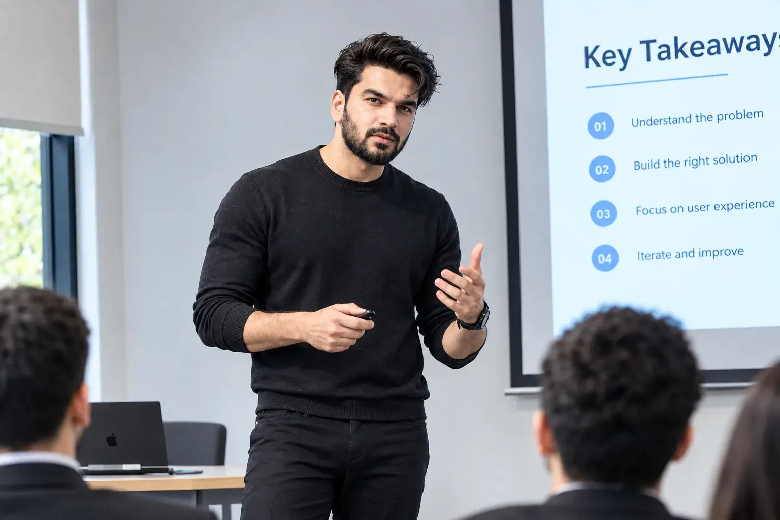 Sultan presenting key takeaways to a team